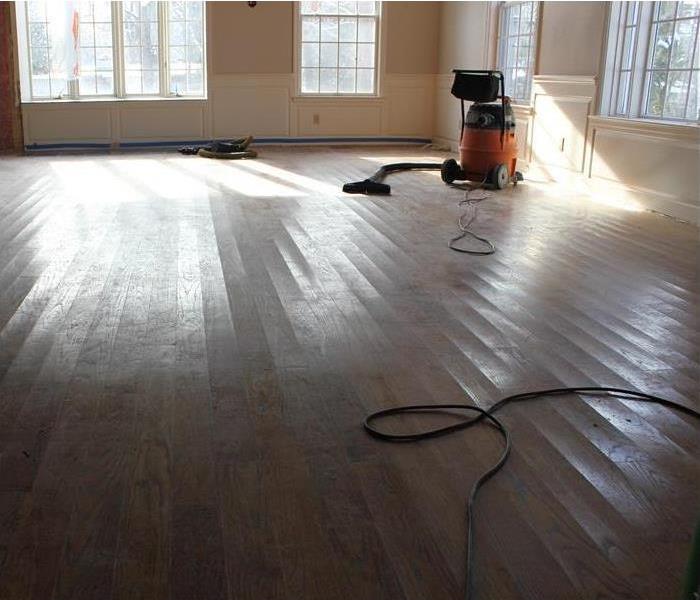 slightly cupped oak floorboards cleared the room of furnishings