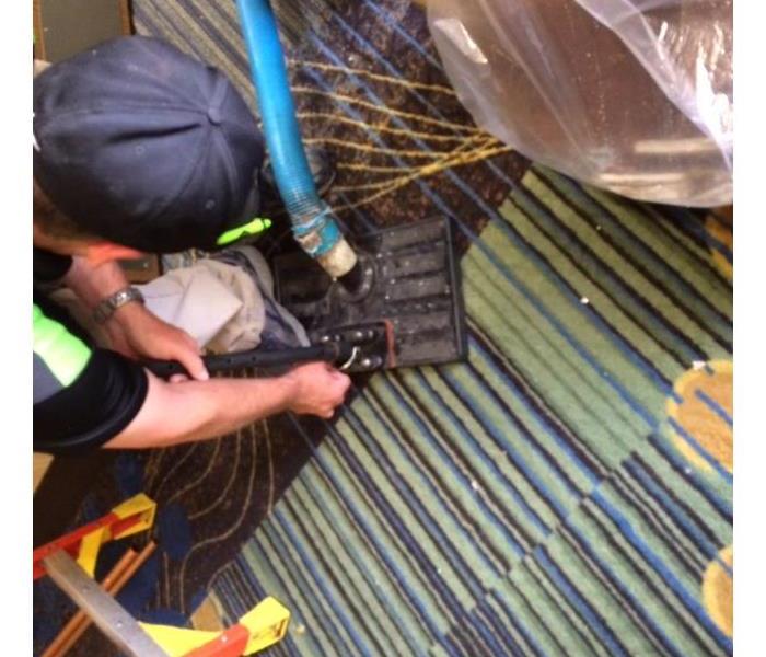 teck cleaning and drying a commercial grade tiled carpet